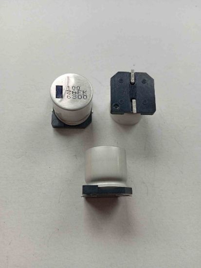 100 2AFK 100MF SMD KONDANSATÖR resmi
